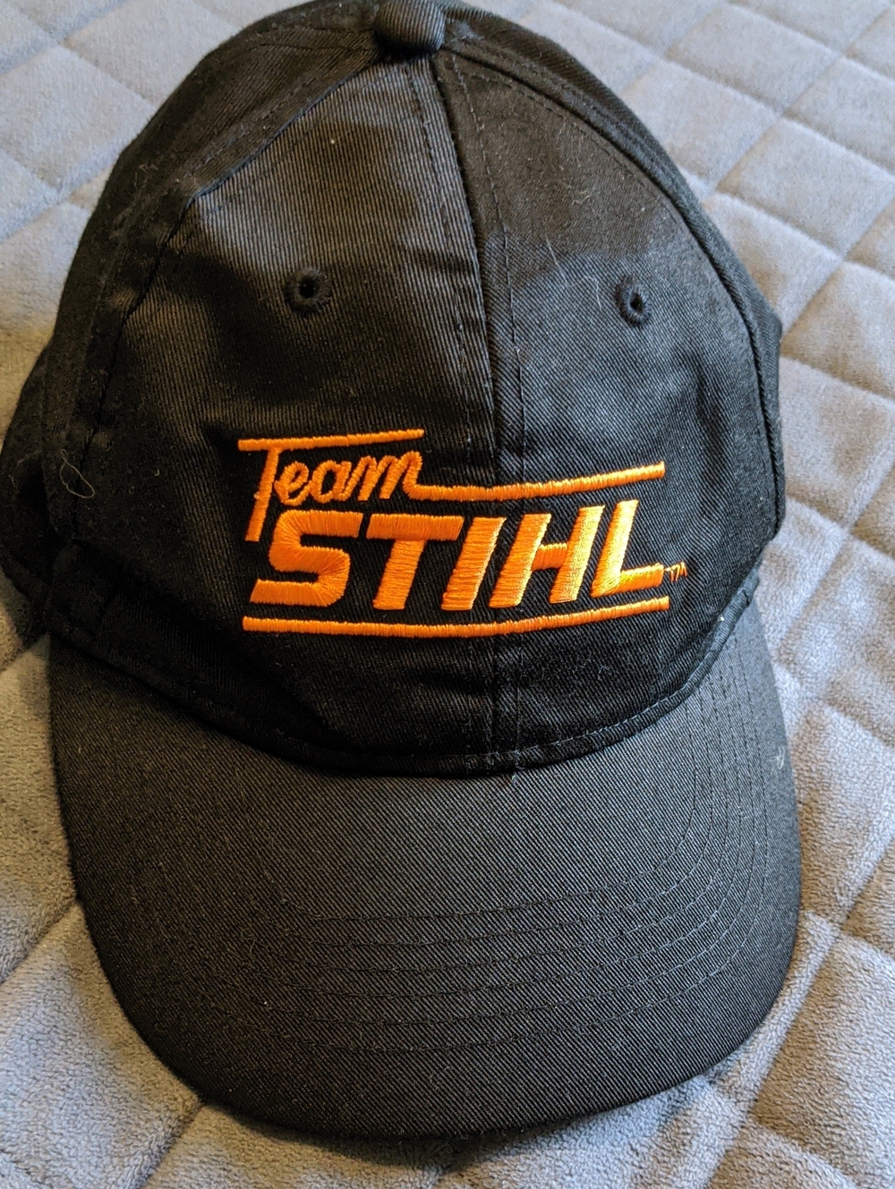 Stihl Outfitters Apparel Team STIHL Black Cap with Orange Embroidered Logo